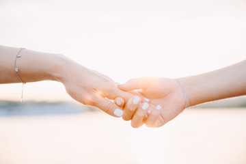 hands of mother and daughter