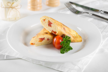 Omelet with ham cheese and tomatoes