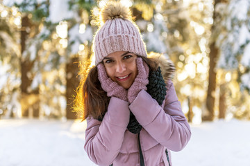 Beautiful girl in the forest at sunset.