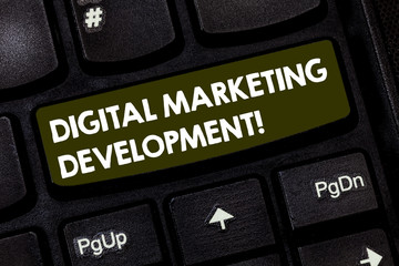 Writing note showing Digital Marketing Development. Business photo showcasing Leverage the digital channels in marketing Keyboard key Intention to create computer message pressing keypad idea