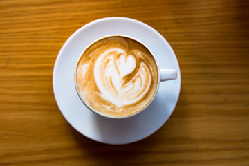 cup of coffee on table.