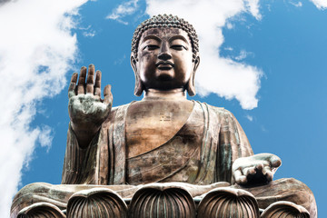 Buddha image in Polin temple in Hong Kong with blue sky