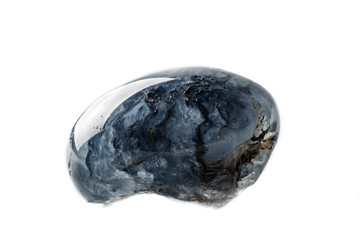 Macro mineral quartz stone with dumortierite on a white background