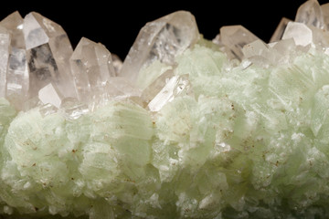 Macro mineral stone Prehnite quartz on a black background