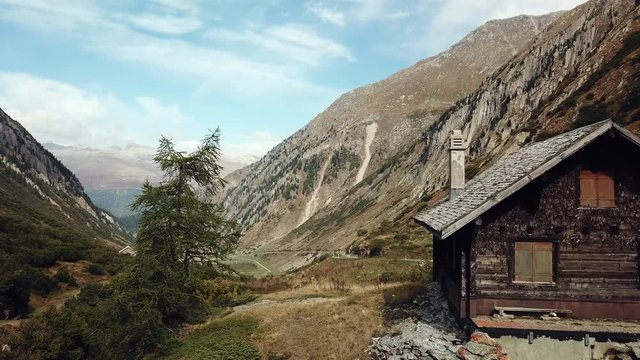 an old house with a beautiful view of a wide valley