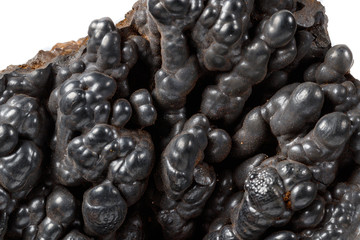 Macro mineral Hematite stone on a white background close-up
