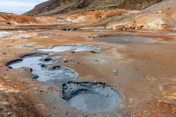 A view of the puddles of mud, salt sulphur springs, Krysuvík, Iceland