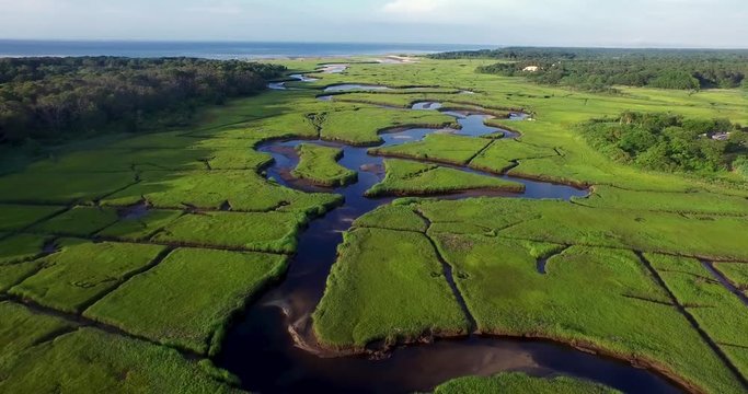 aerial scene of a winding new england, coastal river