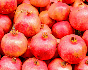 Fototapeta na wymiar raw pomegranates top view closeup, natural background