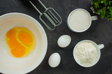 raw dough (eggs, flour and other ingredients). food background. copy space
