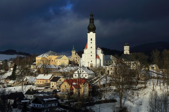 Winter view of the town of Branna,  a small town with beautiful renaissance church and castle in the Jeseniky mountains, Czech Republic.