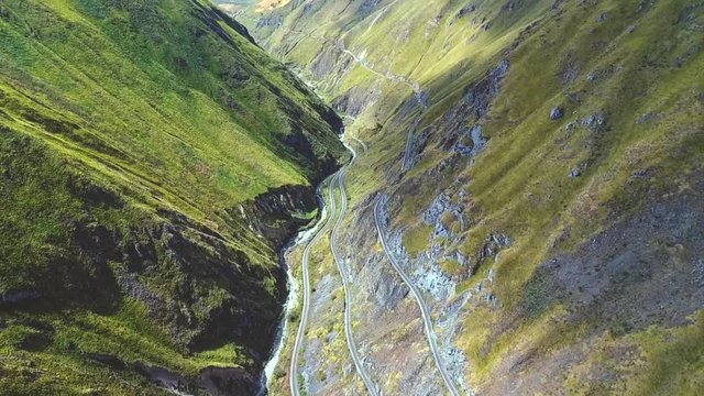 An aerial shot of a train going around the "Nariz del Diablo" or  Devil's Nose in Alaus&radic;&ne;, Chimborazo Province, Ecuador. The Devil's Nose is one of the world's most picturesque and dangerous railways.