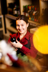 Photo of happy woman in wine shop