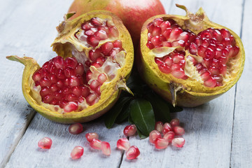 Ripe pomegranate fruit, opened with red seeds