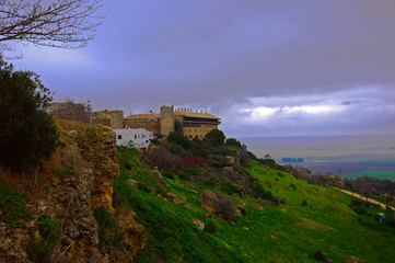 Fototapeta na wymiar Ancient castle in the top of the hill, wide view