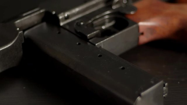 Tilting over World War 2 submachine gun stick magazine and trigger