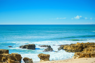 Fototapeta na wymiar Rocks in blue ocean in sunny day