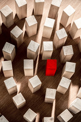 Risk and strategy in business, a lot of wooden blocks with red in the middle