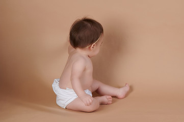 Baby girl touching or drawing on background