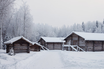 Old wooden houses with barns in North Russia