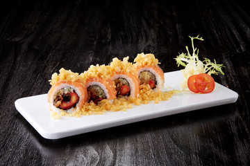 Japanese cuisine,Sushi set: sushi roll with salmon and sushi roll with smoked eel, selective focus.