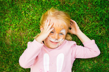 cheerful girl with a painted face