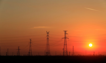 Fototapeta premium High piezoelectric towers, in the setting sun