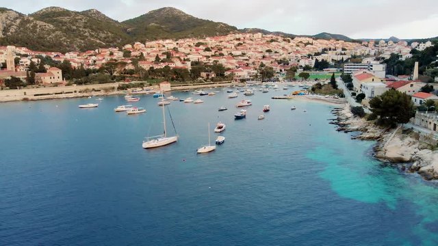 View at the city of Hvar at the island of Hvar from the sea, aerial footage.