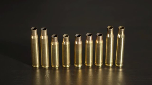 Spent .30-06 en .308 shells standing on a row