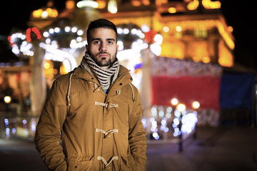 Beautiful young man outdoors  in winter