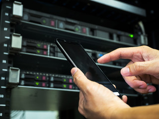 Network administrator use smartphone  to control conputer server system