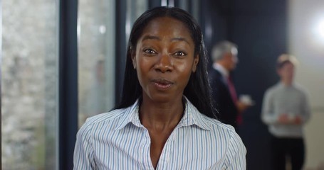 4K Happy young businesswoman making video call from a business conference, seen from other person's point of view.