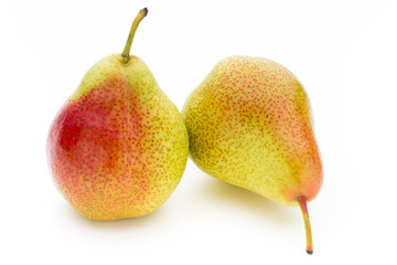 Fresh bio pear with leaves on isolated white background.