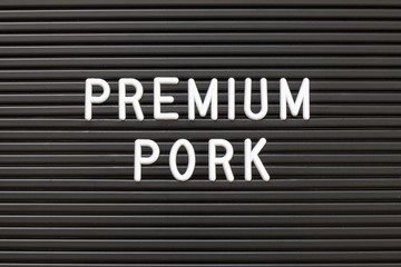 Black color felt letter board with white alphabet in word premium pork background