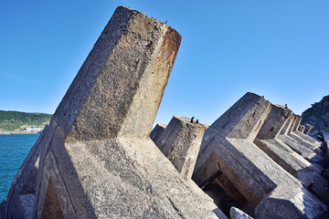 Breakwater blocks at the waterfront for waves protection.