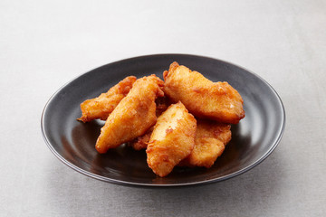 Closeup of  fried meat, on white background