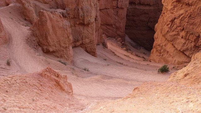 Time-lapse of many hikers on a desert trail with many switchback