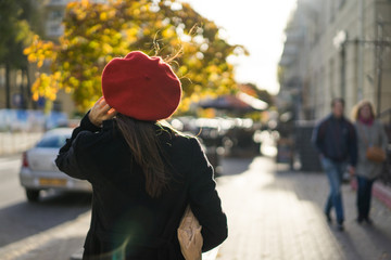Frenchwoman with baguettes on the street in beret