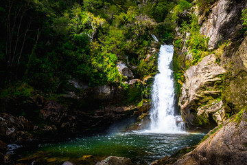 Beautiful waterfalls in the green nature, Wainui Falls, Abel Tasman, New Zealand.