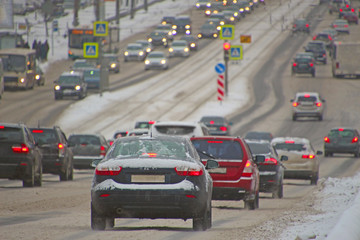 movement of cars on the winter city street