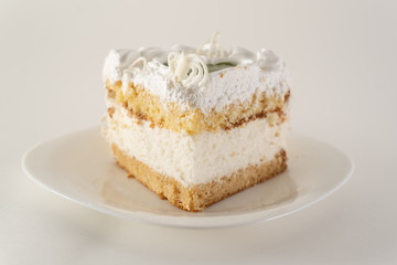 piece of cake on a white plate shot from the side