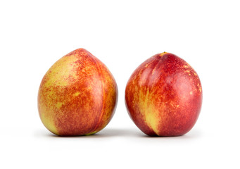 Fresh nectarine isolated on white background.