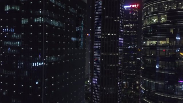 Asia, China. Aerial shot of Guangzhou metropolis downtown city center with office buildings at night.