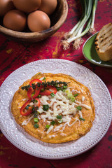 Omelet, fried chicken eggs with fresh vegetables