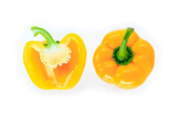 yellow bell pepper cut into pieces on white background, top view.