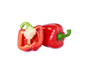 red bell pepper cut into pieces on white background, top view.