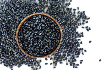 Black bean in bowl on white background.