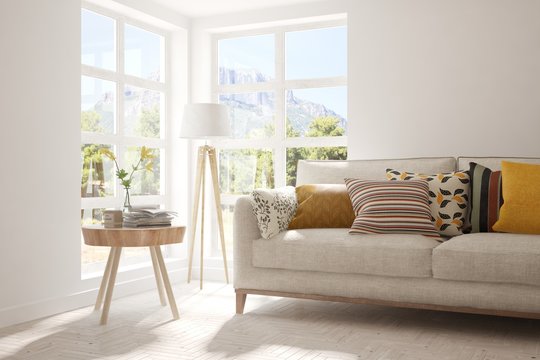 White stylish minimalist room with sofa and smmer landscape in window. Scandinavian interior design. 3D illustration
