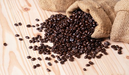 .Coffee beans spilled out from linen sack