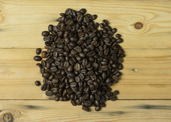 Coffee bean on wooden background,soft focus.